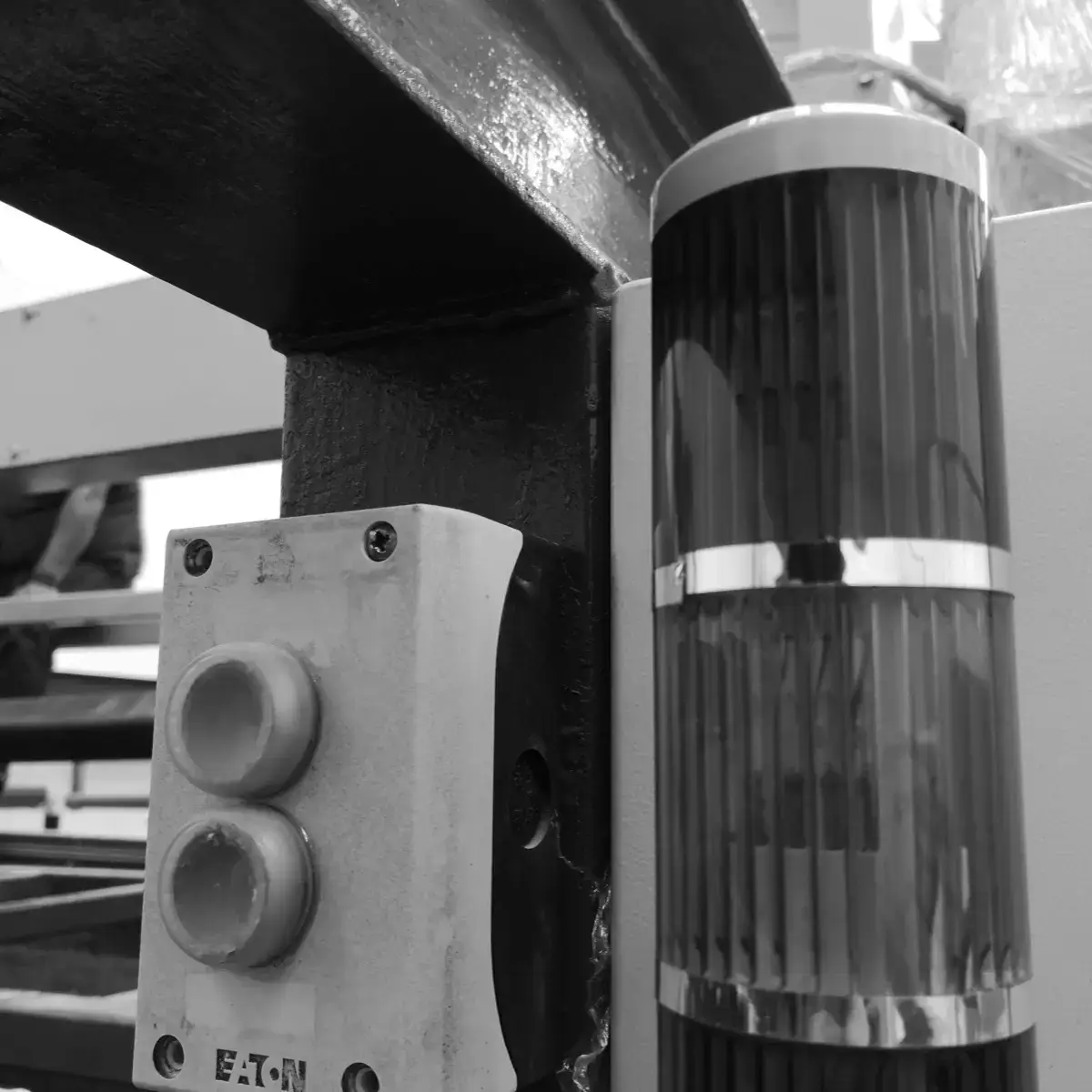 Start and stop pushbuttons and signal tower mounted on the frame of a unit, ready to operate the line.