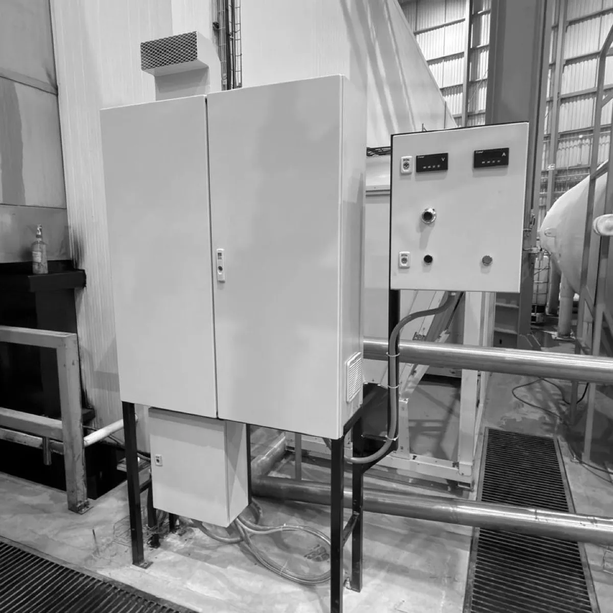 Rectifier cabinet with its control panel, installed beside the process line of a plant